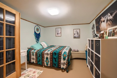 This stunning 4-bed, 3-bath ranch is perched directly across on Ellis Country Club in Kansas - for sale on GolfHomes.com, golf home, golf lot