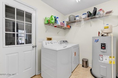 This charming 3-bedroom, 2-bath home is perfectly situated on a on Carolina Shores Golf Course in North Carolina - for sale on GolfHomes.com, golf home, golf lot