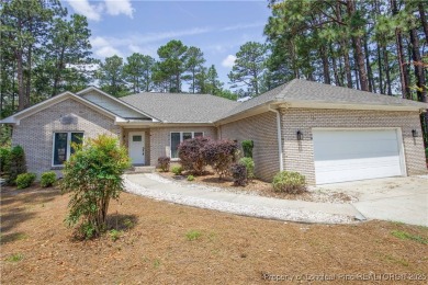 Nestled in the desirable Whispering Pines community and backing on Whispering Woods in North Carolina - for sale on GolfHomes.com, golf home, golf lot