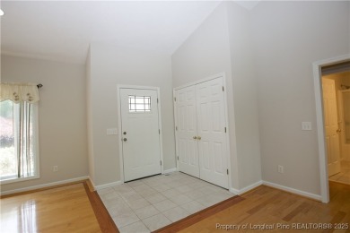 Nestled in the desirable Whispering Pines community and backing on Whispering Woods in North Carolina - for sale on GolfHomes.com, golf home, golf lot