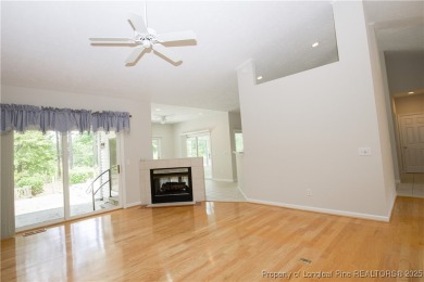 Nestled in the desirable Whispering Pines community and backing on Whispering Woods in North Carolina - for sale on GolfHomes.com, golf home, golf lot