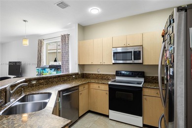 Beautifully appointed 5-bedroom, 2.5-bath residence in the on Weston Hills Country Club in Florida - for sale on GolfHomes.com, golf home, golf lot