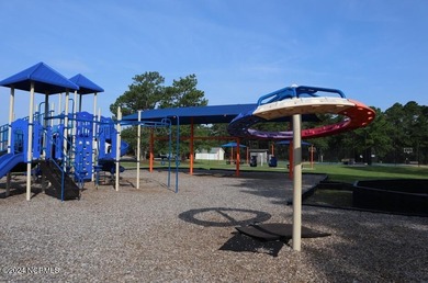 Get ready to fall in love with a home that is thoughtfully on The Lakes Country Club in North Carolina - for sale on GolfHomes.com, golf home, golf lot