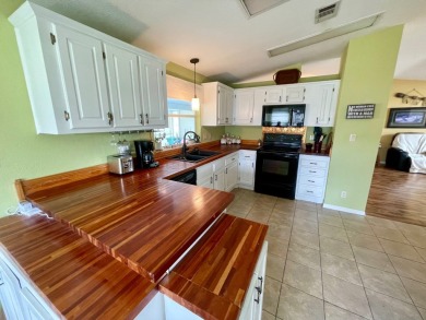 This 2 Bedroom, 2 Bath split floor plan is open and light and on Water Oak Country Club Estates in Florida - for sale on GolfHomes.com, golf home, golf lot