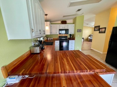 This 2 Bedroom, 2 Bath split floor plan is open and light and on Water Oak Country Club Estates in Florida - for sale on GolfHomes.com, golf home, golf lot