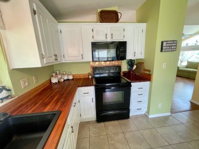 This 2 Bedroom, 2 Bath split floor plan is open and light and on Water Oak Country Club Estates in Florida - for sale on GolfHomes.com, golf home, golf lot