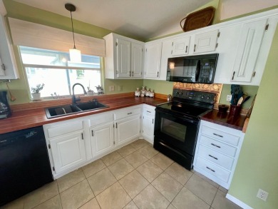 This 2 Bedroom, 2 Bath split floor plan is open and light and on Water Oak Country Club Estates in Florida - for sale on GolfHomes.com, golf home, golf lot