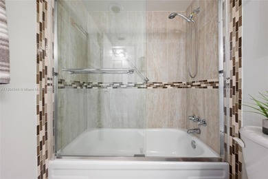 Stunning corner unit condo in the desirable Park Place 55+ on Pembroke Lakes Golf Club in Florida - for sale on GolfHomes.com, golf home, golf lot