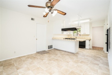 This lovely beach home resides in the center of the Huntington on Meadowlark Golf Club in California - for sale on GolfHomes.com, golf home, golf lot