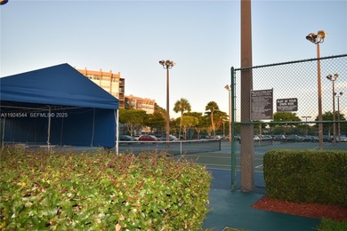 Discover comfort and convenience in this bright 2-bedroom condo on Pembroke Lakes Golf Club in Florida - for sale on GolfHomes.com, golf home, golf lot