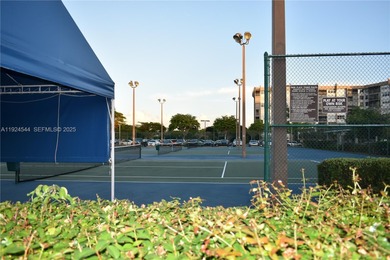 Discover comfort and convenience in this bright 2-bedroom condo on Pembroke Lakes Golf Club in Florida - for sale on GolfHomes.com, golf home, golf lot