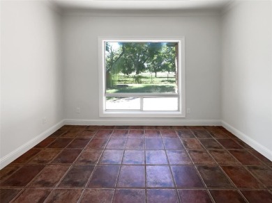 Welcome home to your 3-bedroom 2 bath home with ceramic tile on Pecan Plantation Country Club in Texas - for sale on GolfHomes.com, golf home, golf lot