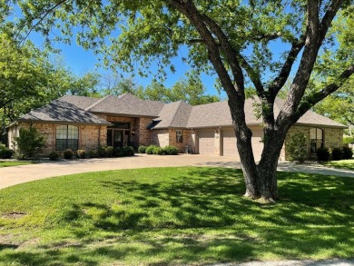 Classic elegance with a tastefully updated finish! This home is on Pecan Plantation Country Club in Texas - for sale on GolfHomes.com, golf home, golf lot