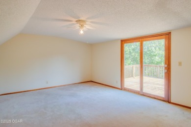 Welcome to your private retreat just outside the city. Set on 3+ on The Bald Eagle Course At Eagle Creek Golf Club in Missouri - for sale on GolfHomes.com, golf home, golf lot