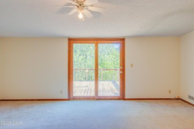 Welcome to your private retreat just outside the city. Set on 3+ on The Bald Eagle Course At Eagle Creek Golf Club in Missouri - for sale on GolfHomes.com, golf home, golf lot