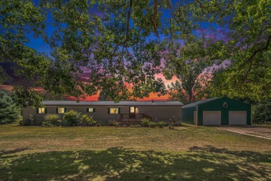 Welcome to 13660 18 Mile Rd., Gowen - a peaceful country retreat on The Links of Bowen Lake in Michigan - for sale on GolfHomes.com, golf home, golf lot