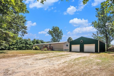 Welcome to 13660 18 Mile Rd., Gowen - a peaceful country retreat on The Links of Bowen Lake in Michigan - for sale on GolfHomes.com, golf home, golf lot