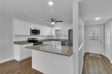 READY TO MOVE IN! ABSOLUTELY STUNNING! This beautifully on On Top Of The World Golf Course in Florida - for sale on GolfHomes.com, golf home, golf lot
