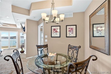 Not 1 but 2 BOAT SLIPS INCLUDED. Top-floor, end-unit lakefront on Seasons Ridge At Four Seasons in Missouri - for sale on GolfHomes.com, golf home, golf lot
