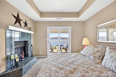 Not 1 but 2 BOAT SLIPS INCLUDED. Top-floor, end-unit lakefront on Seasons Ridge At Four Seasons in Missouri - for sale on GolfHomes.com, golf home, golf lot