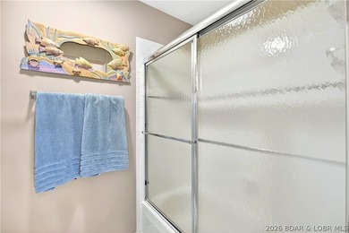 Not 1 but 2 BOAT SLIPS INCLUDED. Top-floor, end-unit lakefront on Seasons Ridge At Four Seasons in Missouri - for sale on GolfHomes.com, golf home, golf lot