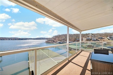 Not 1 but 2 BOAT SLIPS INCLUDED. Top-floor, end-unit lakefront on Seasons Ridge At Four Seasons in Missouri - for sale on GolfHomes.com, golf home, golf lot
