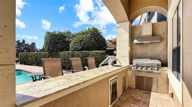 Welcome to an extraordinary Mediterranean-inspired estate on ChampionsGate Golf Resort in Florida - for sale on GolfHomes.com, golf home, golf lot