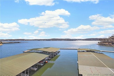 Not 1 but 2 BOAT SLIPS INCLUDED. Top-floor, end-unit lakefront on Seasons Ridge At Four Seasons in Missouri - for sale on GolfHomes.com, golf home, golf lot