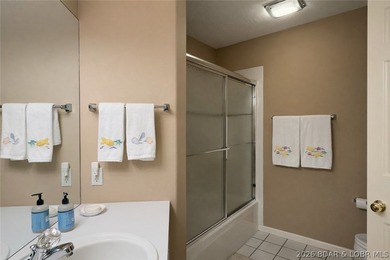 Not 1 but 2 BOAT SLIPS INCLUDED. Top-floor, end-unit lakefront on Seasons Ridge At Four Seasons in Missouri - for sale on GolfHomes.com, golf home, golf lot