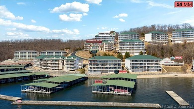 Not 1 but 2 BOAT SLIPS INCLUDED. Top-floor, end-unit lakefront on Seasons Ridge At Four Seasons in Missouri - for sale on GolfHomes.com, golf home, golf lot