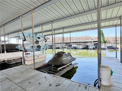 Not 1 but 2 BOAT SLIPS INCLUDED. Top-floor, end-unit lakefront on Seasons Ridge At Four Seasons in Missouri - for sale on GolfHomes.com, golf home, golf lot