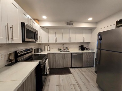 Welcome to this gut-renovated 2-bedroom, 2-bathroom penthouse on The Club at Emerald Hills in Florida - for sale on GolfHomes.com, golf home, golf lot