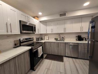 Welcome to this gut-renovated 2-bedroom, 2-bathroom penthouse on The Club at Emerald Hills in Florida - for sale on GolfHomes.com, golf home, golf lot