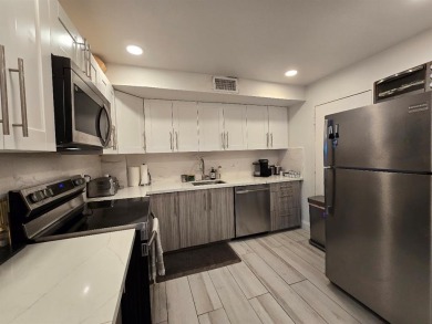 Welcome to this gut-renovated 2-bedroom, 2-bathroom penthouse on The Club at Emerald Hills in Florida - for sale on GolfHomes.com, golf home, golf lot
