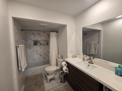 Welcome to this gut-renovated 2-bedroom, 2-bathroom penthouse on The Club at Emerald Hills in Florida - for sale on GolfHomes.com, golf home, golf lot