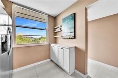 Lakefront Golf Course Condo. Move-in ready and beautifully on Pine Island Ridge Country Club in Florida - for sale on GolfHomes.com, golf home, golf lot