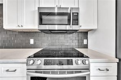 Lakefront Golf Course Condo. Move-in ready and beautifully on Pine Island Ridge Country Club in Florida - for sale on GolfHomes.com, golf home, golf lot