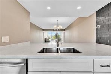 Lakefront Golf Course Condo. Move-in ready and beautifully on Pine Island Ridge Country Club in Florida - for sale on GolfHomes.com, golf home, golf lot