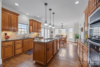 This five-bedroom, four-and-a-half-bathroom full brick home is on Emerald Lake Golf Club in North Carolina - for sale on GolfHomes.com, golf home, golf lot