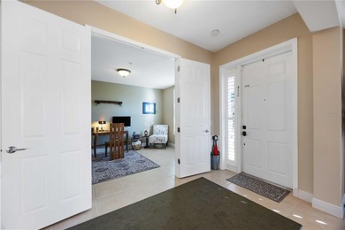 Discover refined Florida living at 23619 Awabuki Drive in the on Sarasota National Golf Club in Florida - for sale on GolfHomes.com, golf home, golf lot