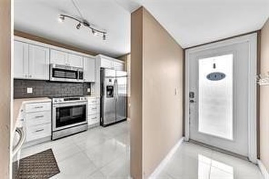 Lakefront Golf Course Condo. Move-in ready and beautifully on Pine Island Ridge Country Club in Florida - for sale on GolfHomes.com, golf home, golf lot