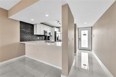 Lakefront Golf Course Condo. Move-in ready and beautifully on Pine Island Ridge Country Club in Florida - for sale on GolfHomes.com, golf home, golf lot