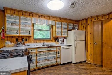 Tucked in Sky Valley's golf community, this tiny treehouse on Sky Valley Resort and Country Club in Georgia - for sale on GolfHomes.com, golf home, golf lot