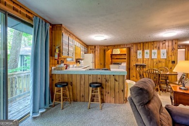 Tucked in Sky Valley's golf community, this tiny treehouse on Sky Valley Resort and Country Club in Georgia - for sale on GolfHomes.com, golf home, golf lot