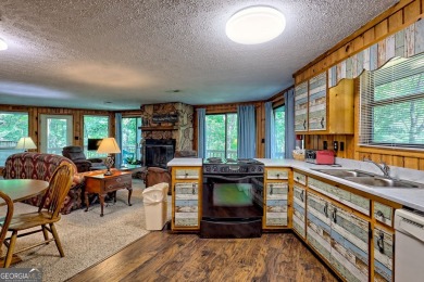 Tucked in Sky Valley's golf community, this tiny treehouse on Sky Valley Resort and Country Club in Georgia - for sale on GolfHomes.com, golf home, golf lot