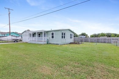 Ride your golf cart to dining, the beach, and downtown from this on Rockport Country Club in Texas - for sale on GolfHomes.com, golf home, golf lot