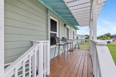 Ride your golf cart to dining, the beach, and downtown from this on Rockport Country Club in Texas - for sale on GolfHomes.com, golf home, golf lot