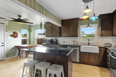 Ride your golf cart to dining, the beach, and downtown from this on Rockport Country Club in Texas - for sale on GolfHomes.com, golf home, golf lot