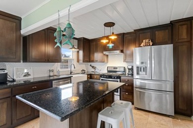 Ride your golf cart to dining, the beach, and downtown from this on Rockport Country Club in Texas - for sale on GolfHomes.com, golf home, golf lot