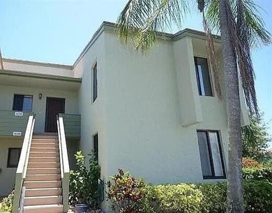 This beautifully updated, second-floor corner-unit condo on Miles Grant Country Club in Florida - for sale on GolfHomes.com, golf home, golf lot